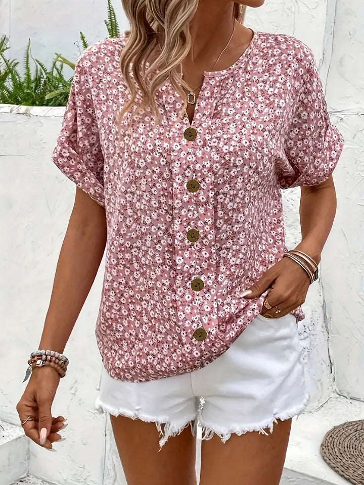 Pink floral print women's long sleeve button-up blouse with relaxed fit, ideal for elegant spring fashion.
