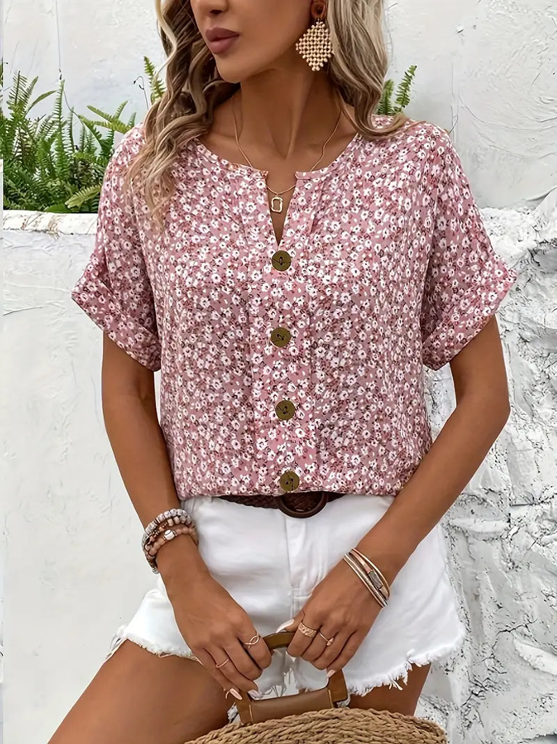 Stylish pink floral women's relaxed fit long sleeve blouse. Elegant button-up top for spring summer fashion.