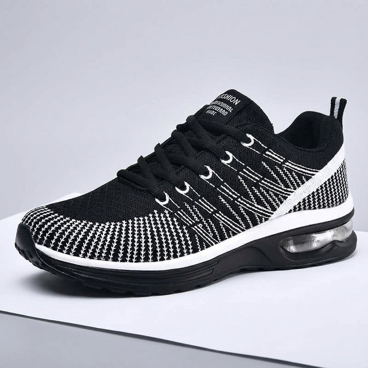 Breathable knit athletic sneakers in pink, offering orthopedic support for women