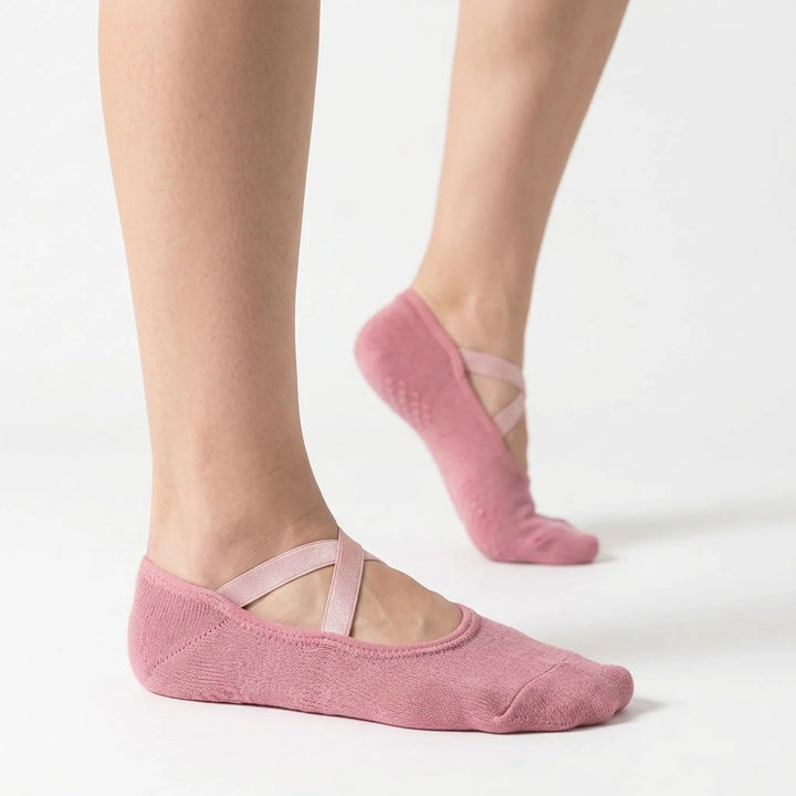 Pair of women's activewear grip socks, ideal for studio workouts, yoga, pilates; non-slip comfort.
