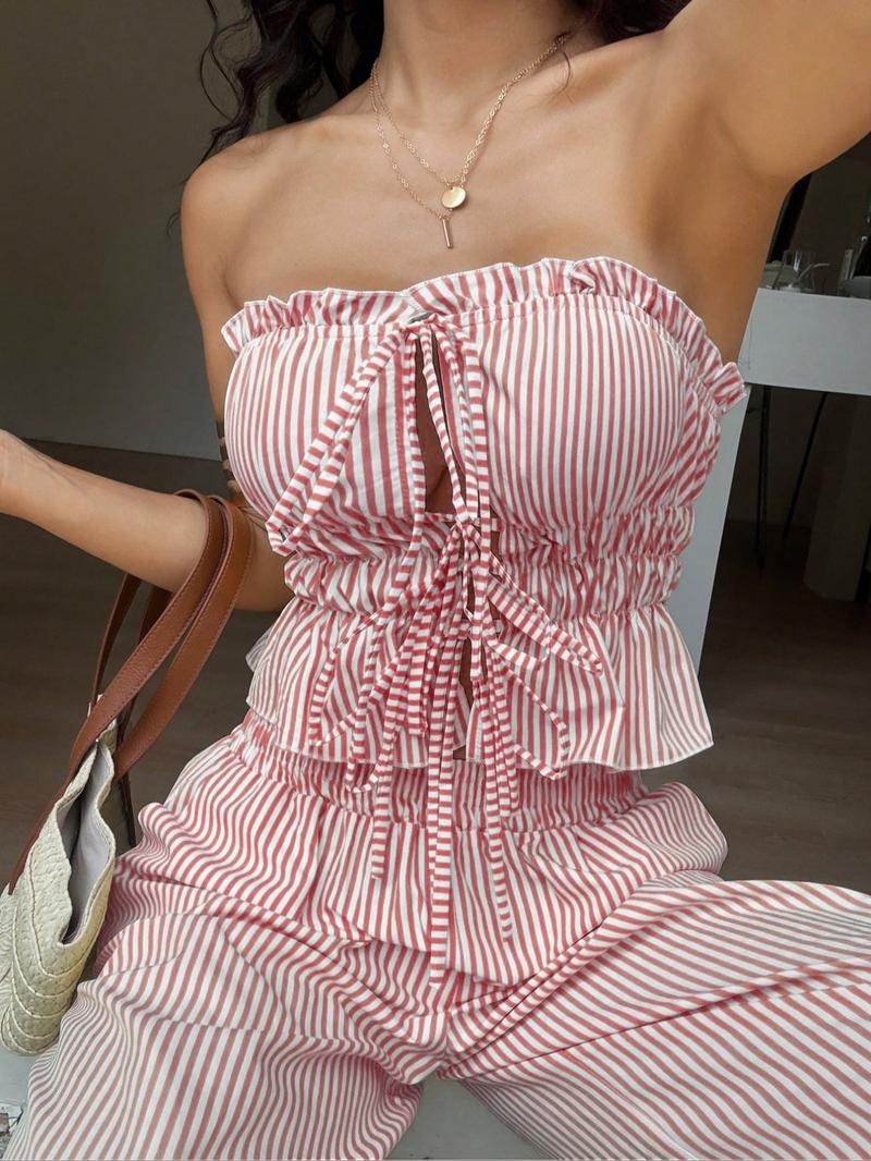 Women's pinstripe bandeau top and wide leg pant two-piece set, elegant summer outfit.