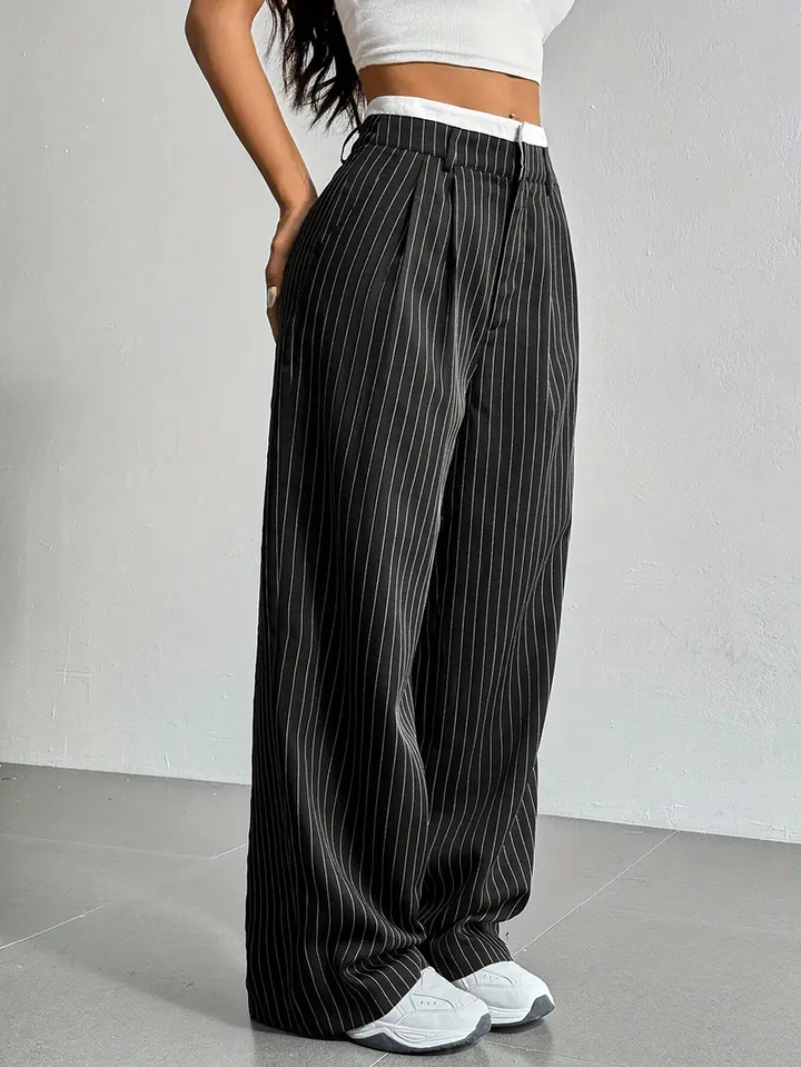 Women's pinstripe wide-leg trousers, a stylish and comfortable choice for casual chic outfits.