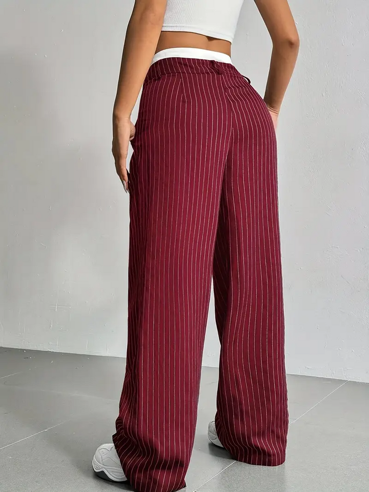 Streetwear-inspired women's pinstripe wide-leg trousers for a cool, comfortable fashion statement.