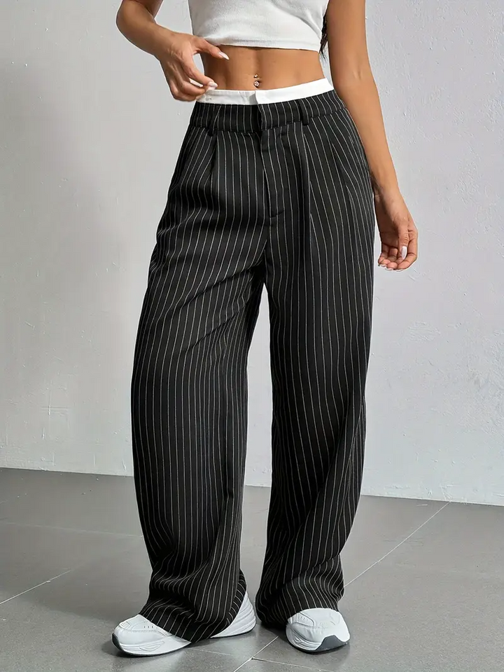 Relaxed fit women's pinstripe wide-leg trousers with an elastic waist for ultimate comfort.