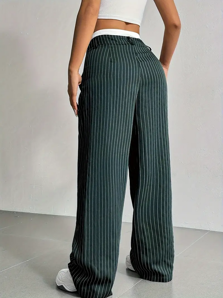 Versatile women's pinstripe wide-leg trousers, ideal for streetwear or elegant casual outfits.