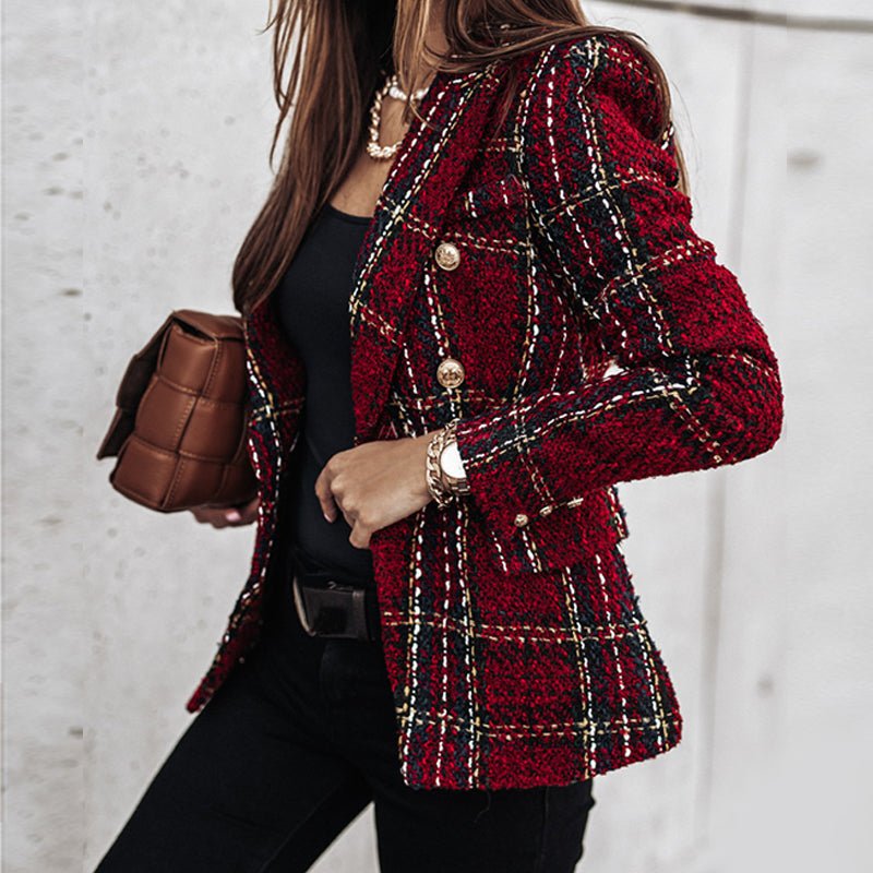Woman wearing a chic plaid double-breasted blazer with gold buttons. A tailored jacket for elegant business casual outfits.