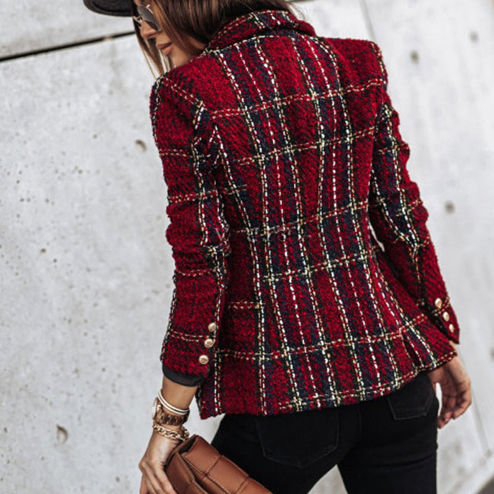 Elegant women's tailored plaid blazer featuring prominent gold buttons & a stylish double-breasted cut. Office & fashion wear.