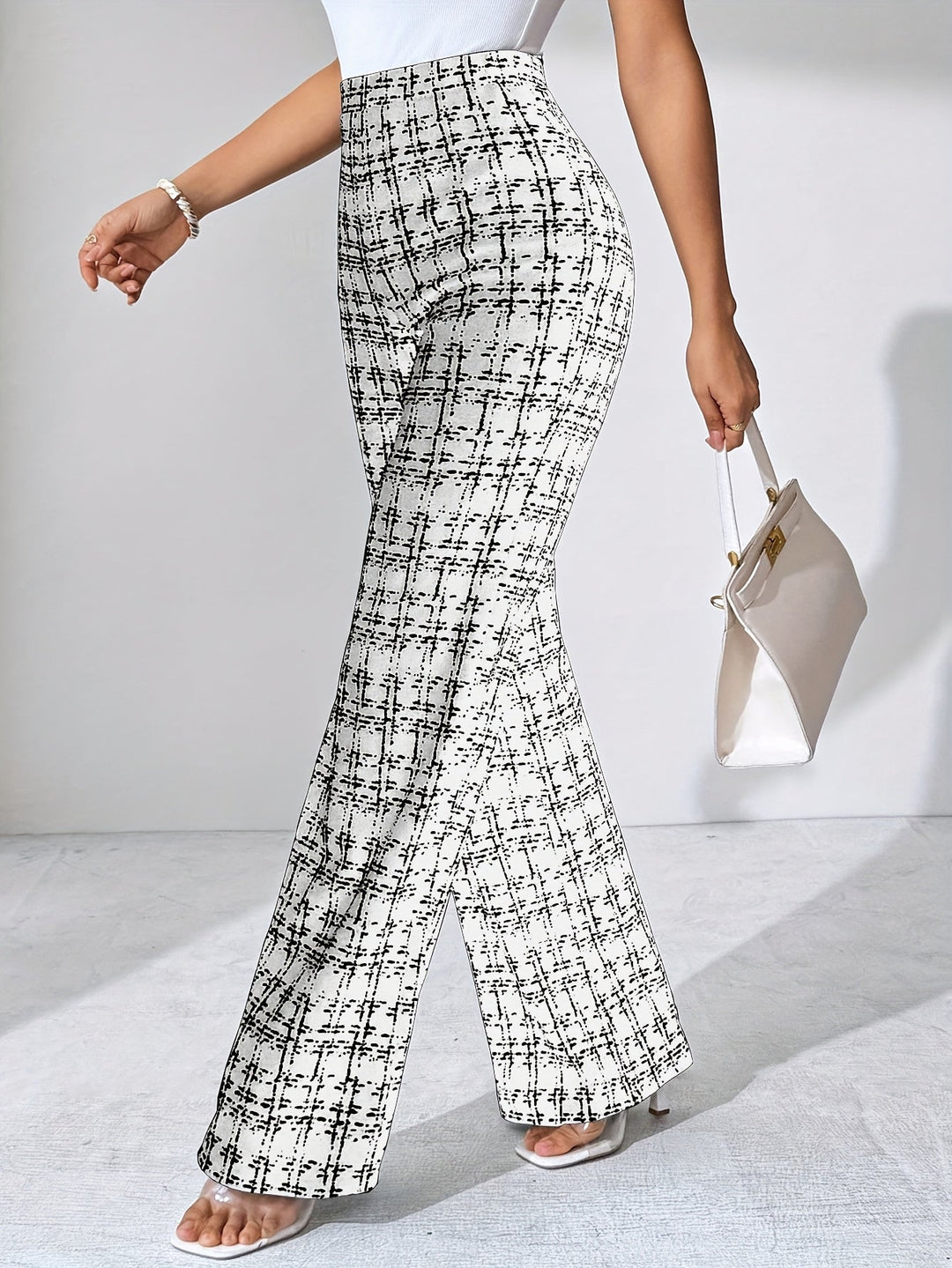 Comfortable women's high-waisted plaid flare trousers, featuring a flattering stretch knit.