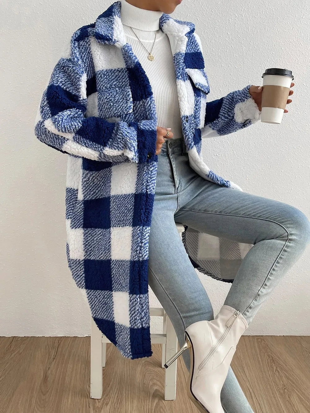 Women's plaid longline jacket, cozy & stylish outerwear for fall & winter. Features button-up front.