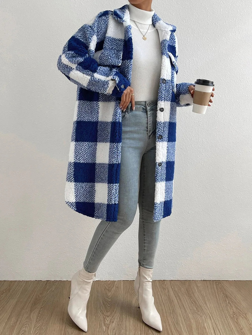 Warm women's longline plaid coat with button-up closure and stand collar, perfect for winter wear.