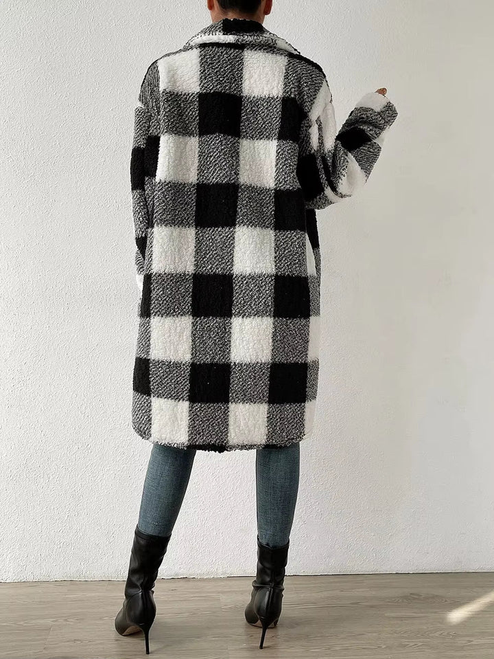 Women's longline plaid jacket with a comfortable fit, great for chilly fall days and layering.