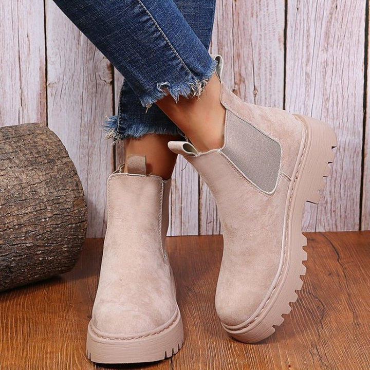 Women's platform Chelsea boots with elastic panels, chunky sole. Effortless slip-on ankle boots for casual style.