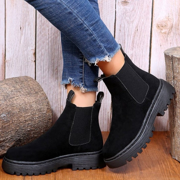 Modern women's platform Chelsea boots. Easy slip-on ankle boots with elastic panels and a bold chunky sole.