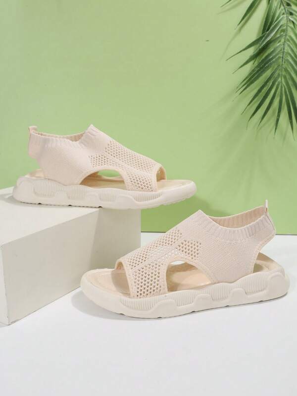 Beige open-toe platform sandals for women. Comfortable slip-on walking shoes for everyday wear.
