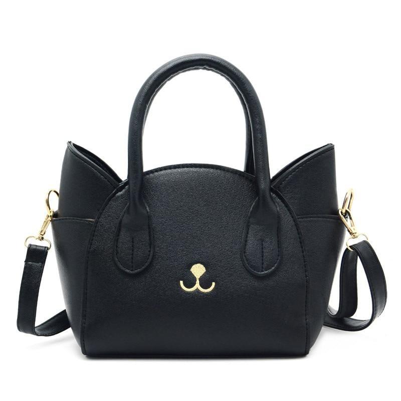Women's playful cat accent handbag in faux leather, a cute everyday purse for feline fashion lovers.