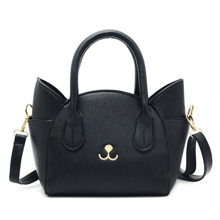 Women's playful cat accent handbag in faux leather, a cute everyday purse for feline fashion lovers.
