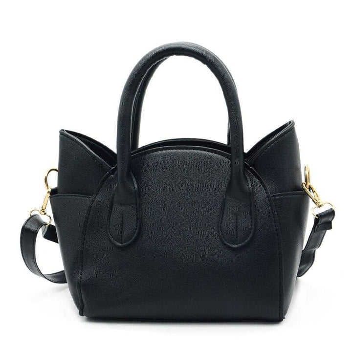 Versatile silver women's cat accent shoulder bag, a fashionable faux leather everyday purse.