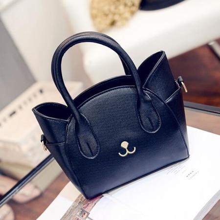 Black women's shoulder bag with a playful cat accent, perfect faux leather crossbody for daily use.