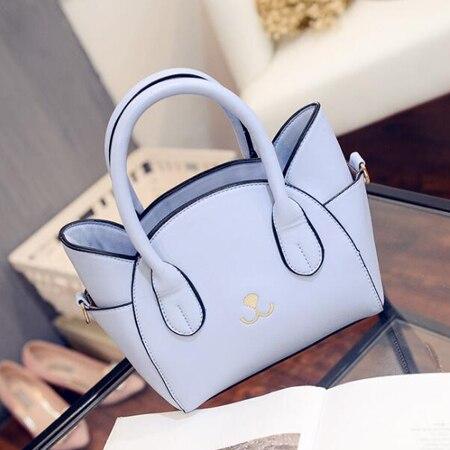 Blue faux leather CatWalk™ women's handbag, a stylish and cute cat bag for modern feline fashion.