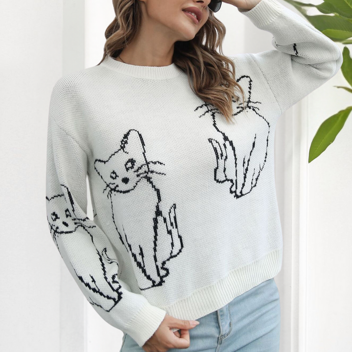 Playful women's pullover sweater featuring cute cat graphics, a trendy long sleeve top for casual autumn outfits.