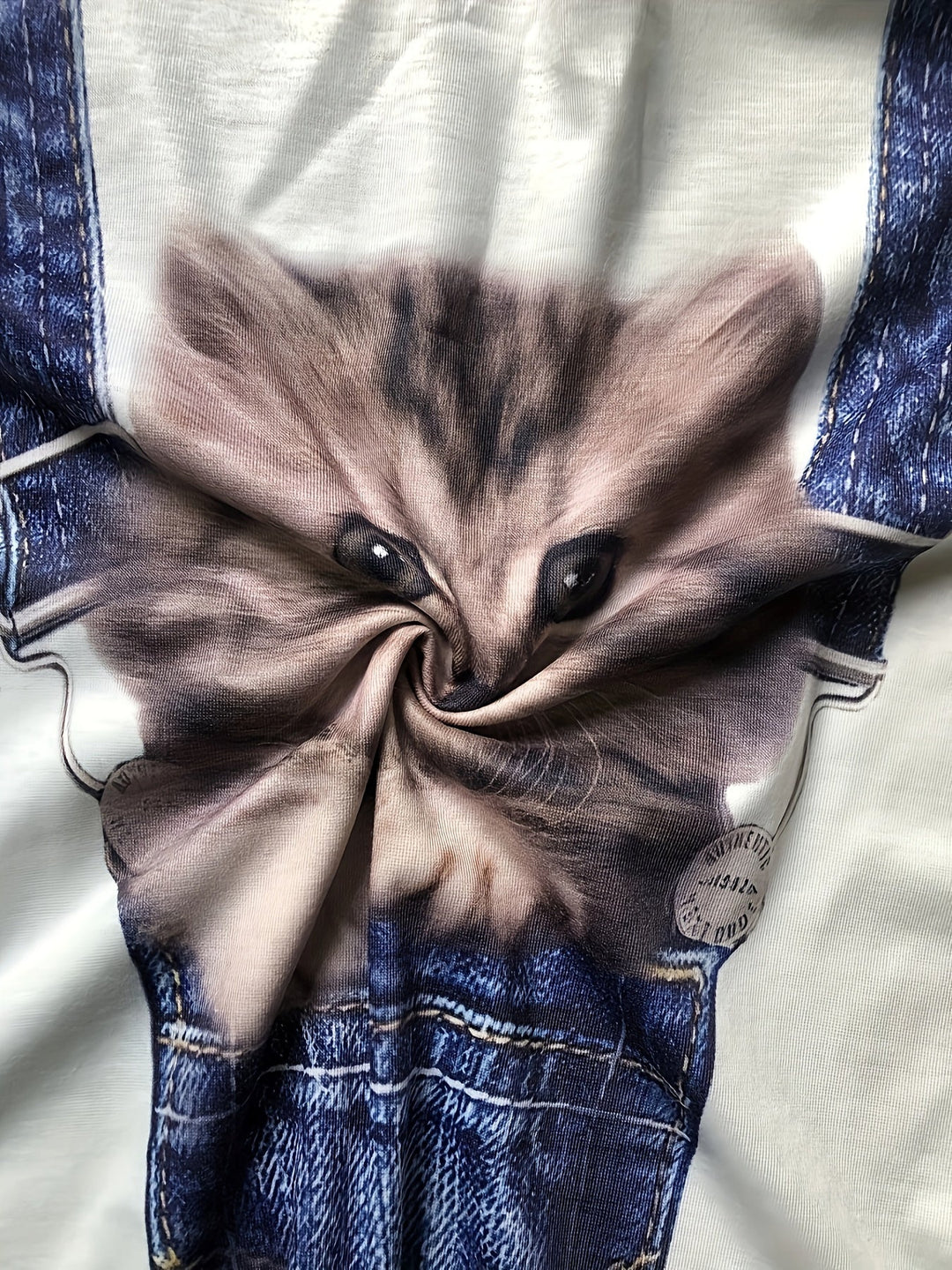 Stylish women's t-shirt with playful cat print and chic color block design. Ideal for casual spring fashion.