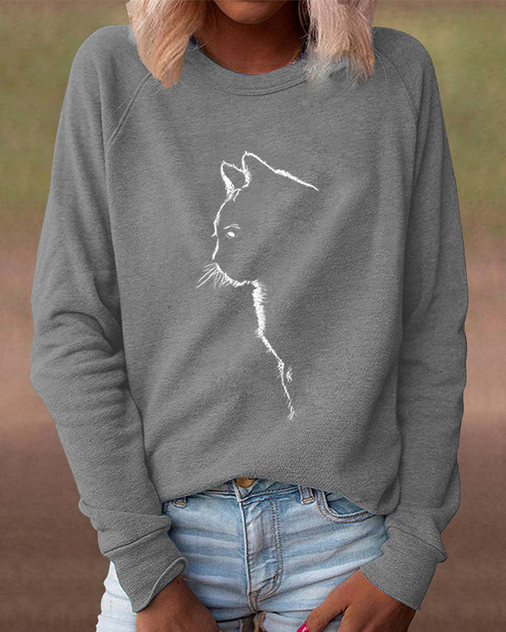 Stylish winter women's loose fit sweatshirt with a fun cat print. Long sleeve casual top.