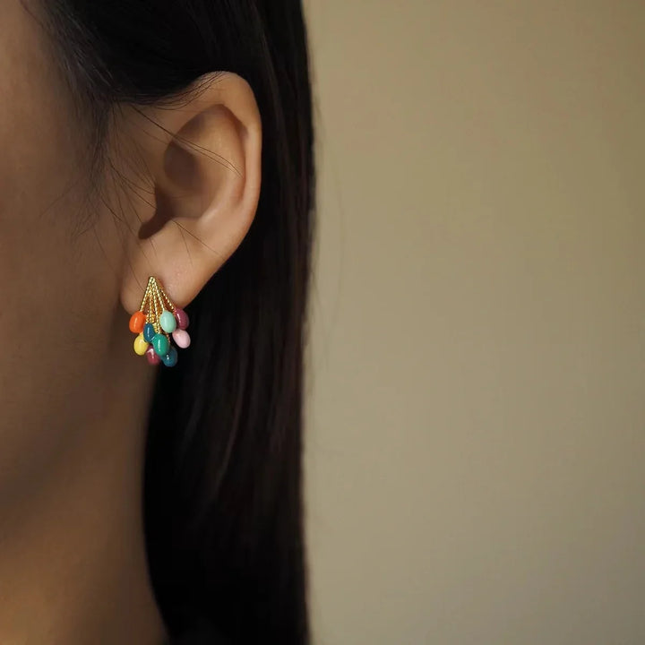 Women's playful multicolor enamel balloon stud earrings with gold-tone accents. Vibrant and unique jewelry.