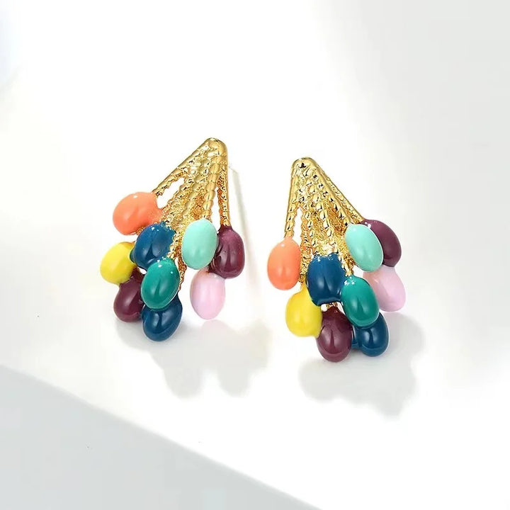 A pair of women's playful balloon stud earrings, multicolor enamel with a gold-tone finish. Cute and vibrant accessory.