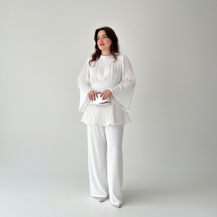 Versatile women's lounge set: pleated top and wide leg pants in a neutral color.