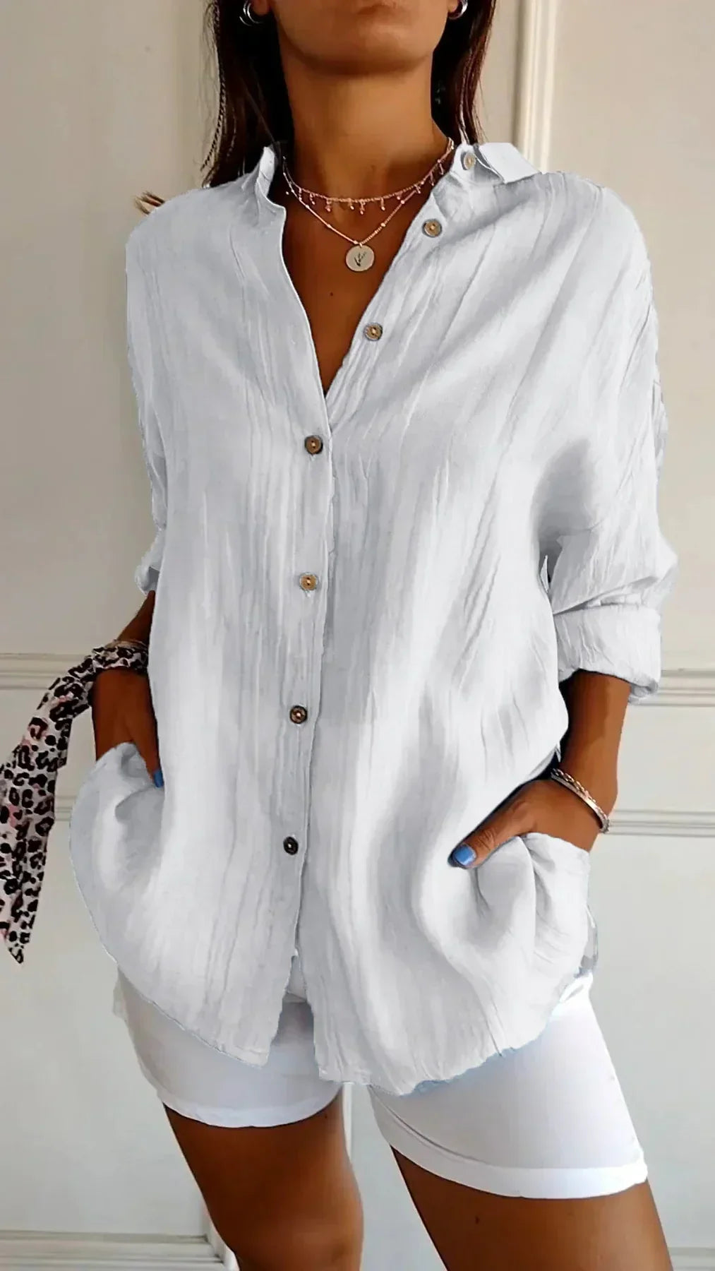 Women's pleated lightweight blouse. Effortless style for casual wear, work attire, or summer fashion.
