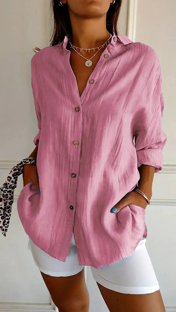 Back view of women's Elodie pleated lightweight blouse, showing its relaxed, flowy fit and comfort.