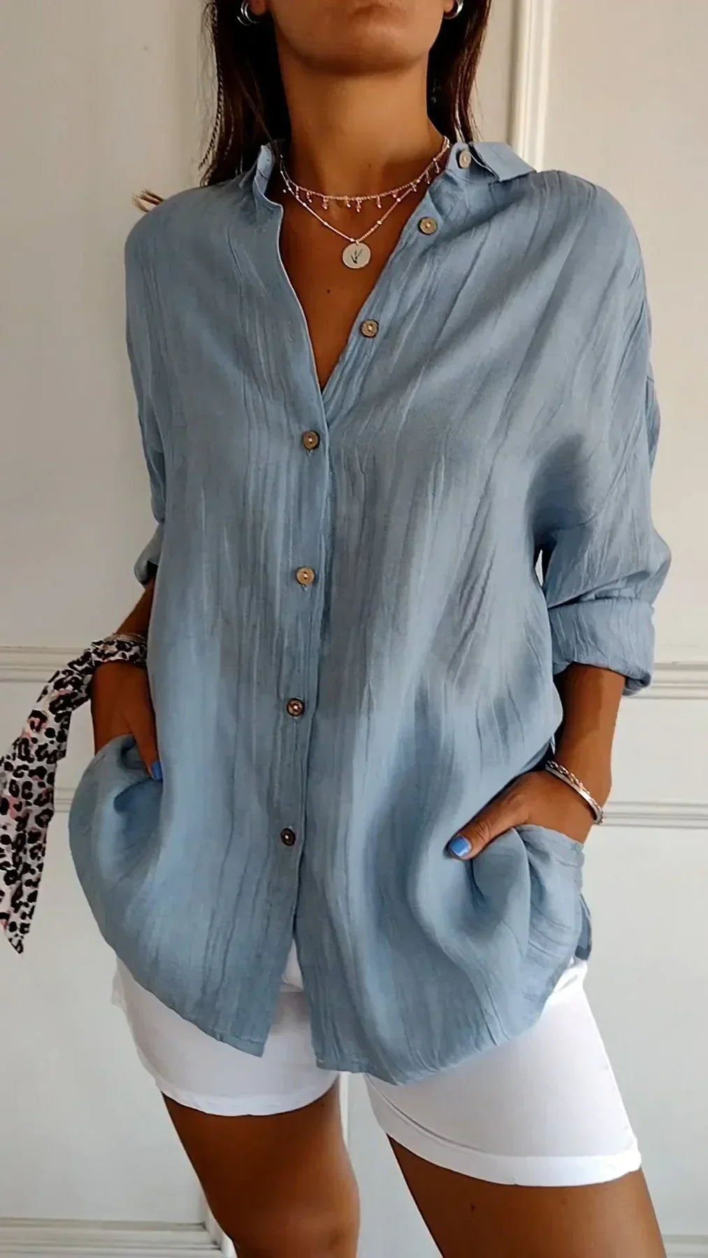 Pleated women's blouse for versatile styling. Lightweight and comfortable for all-day wear and fashion.
