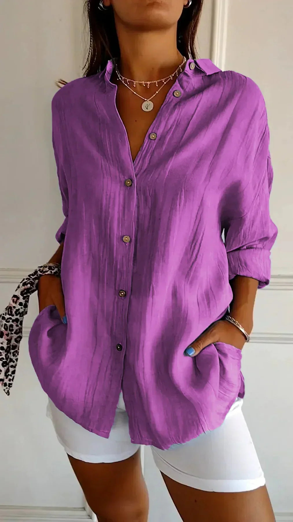 Lightweight women's blouse with delicate pleats. Ideal for comfortable summer and spring fashion.