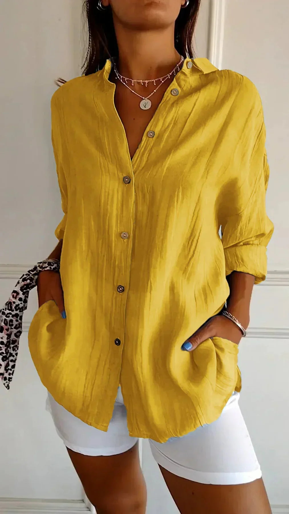 Front view of a women's pleated lightweight blouse. Classic, elegant, and comfortable for any outfit.