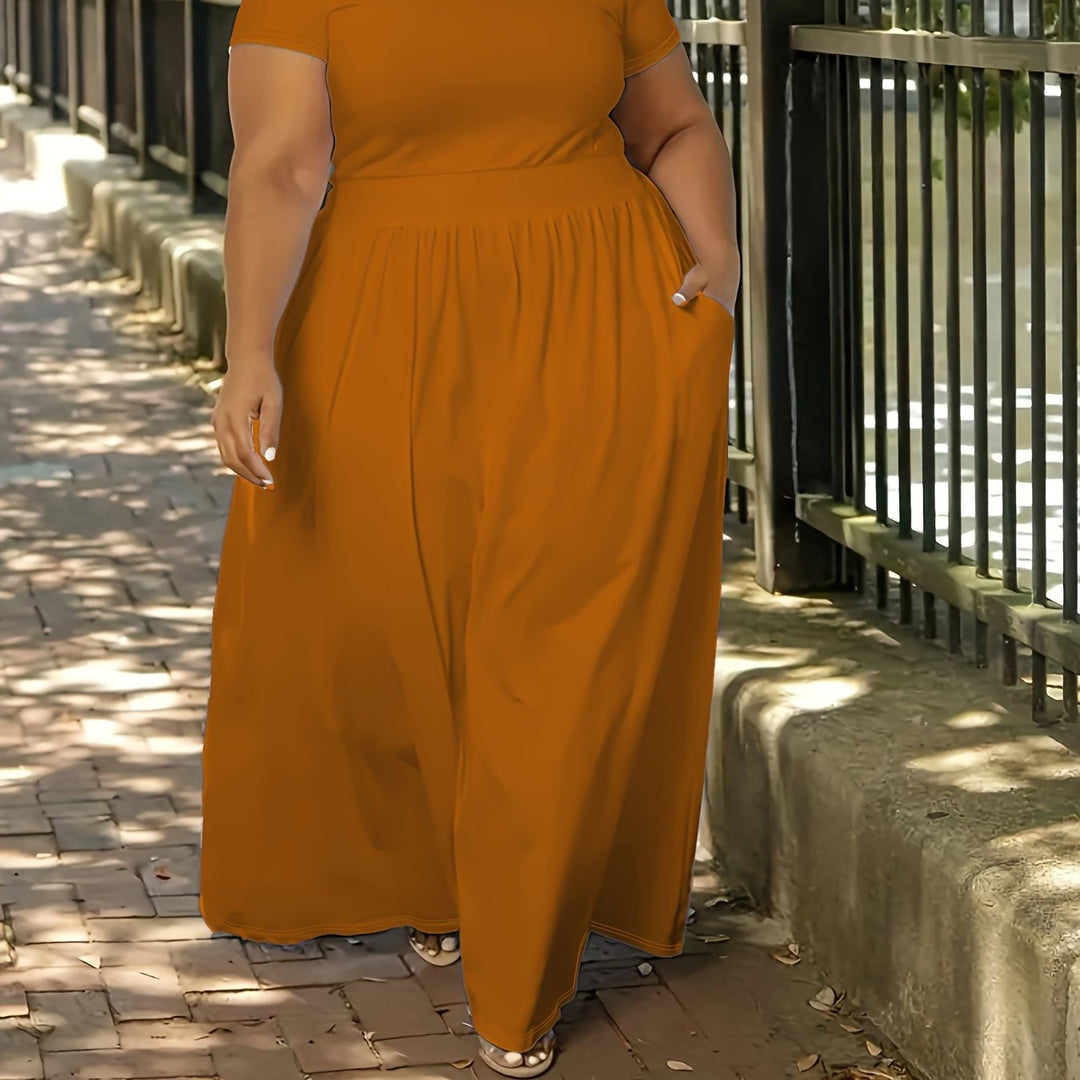 Plus size women's short sleeve flowy maxi dress. Comfortable, casual, and elegant for summer fun.