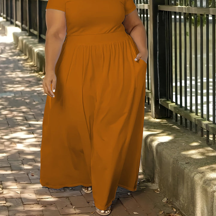 Plus size women's short sleeve flowy maxi dress. Comfortable, casual, and elegant for summer fun.