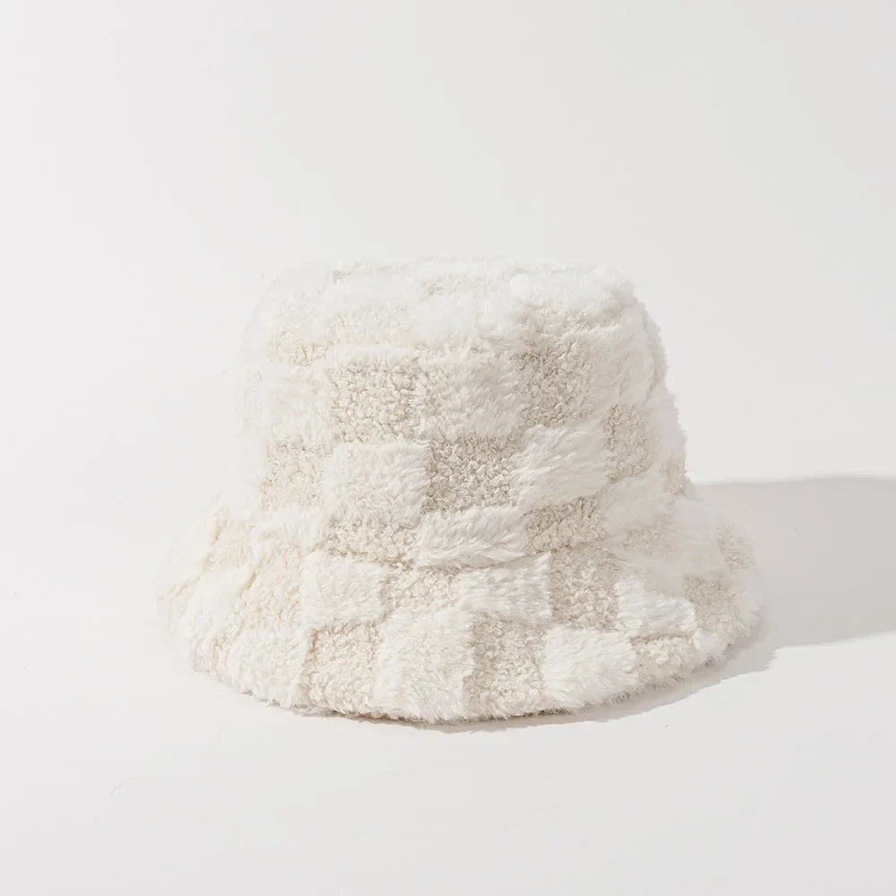 Soft plush checkerboard bucket hat for women, fashionable warm winter accessory.