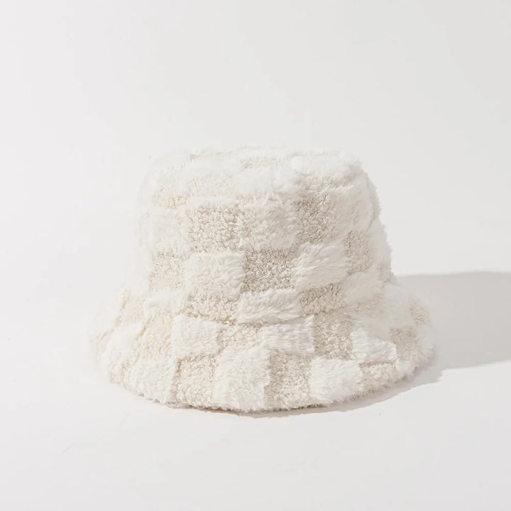 Soft plush checkerboard bucket hat for women, fashionable warm winter accessory.