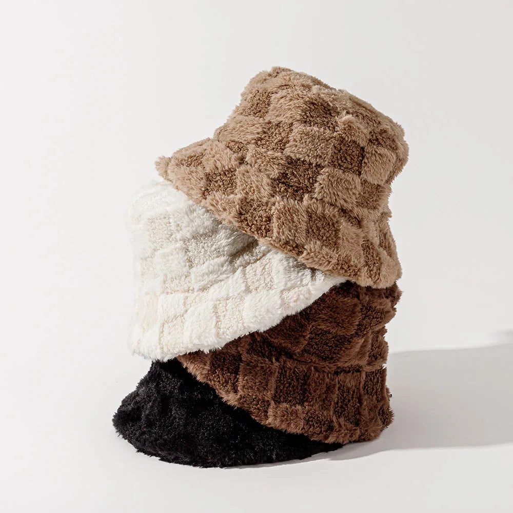 Fuzzy plush checkerboard bucket hat for women, a comfortable and stylish winter fashion accessory.