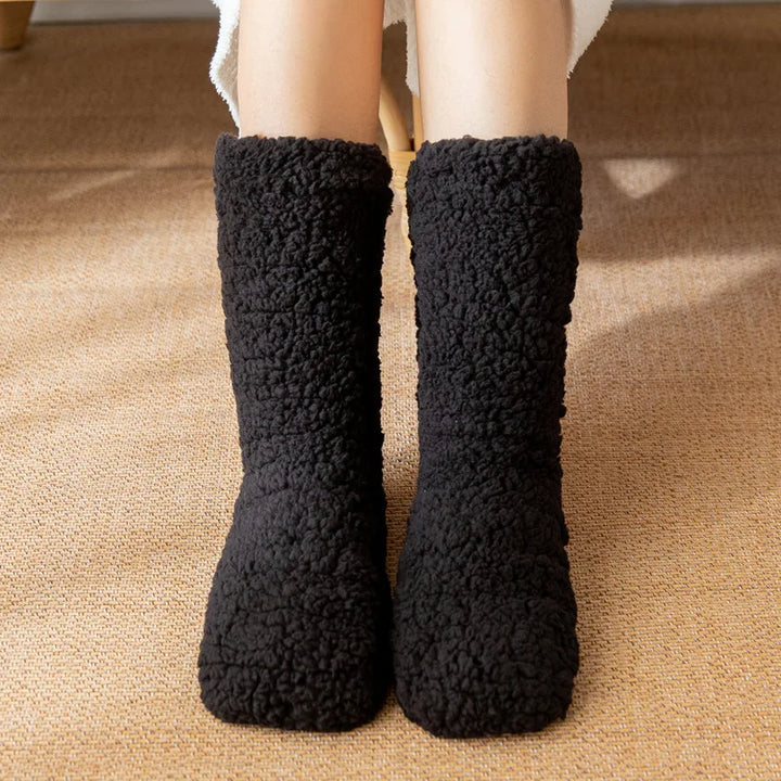 Stay warm with these cozy plush women's winter socks. Mid-calf, no-slip design ensures ultimate foot comfort; a great gift.