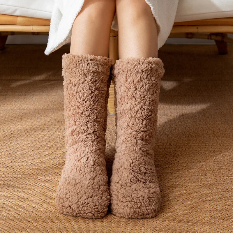 Super cozy plush women's winter socks for warmth & comfort. Mid-calf, no-slip design, perfect for chilly days.