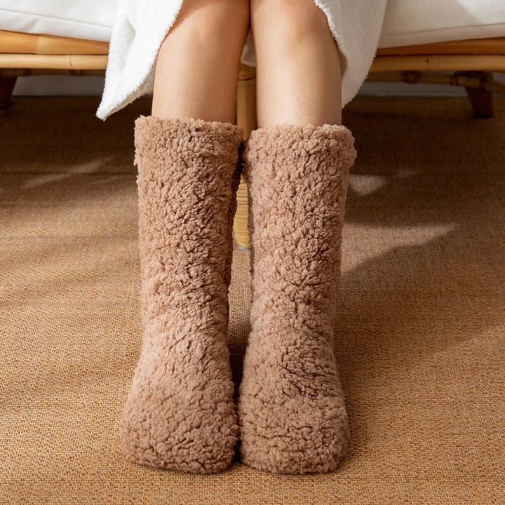 Super cozy plush women's winter socks for warmth & comfort. Mid-calf, no-slip design, perfect for chilly days.