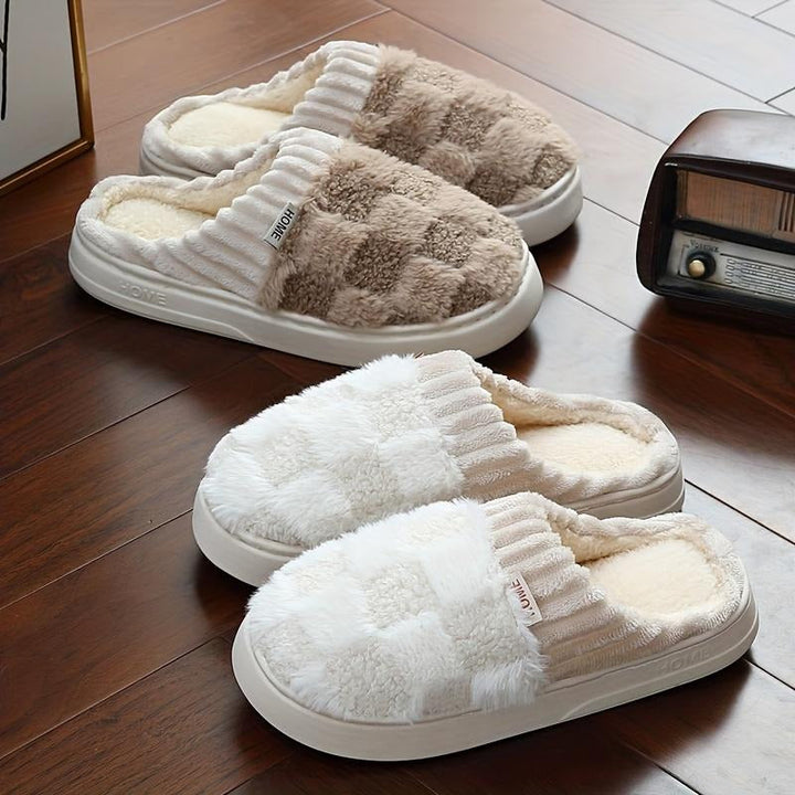 Soft women's plush comfort slippers for indoor wear, providing warmth and coziness. Available in multiple colors.