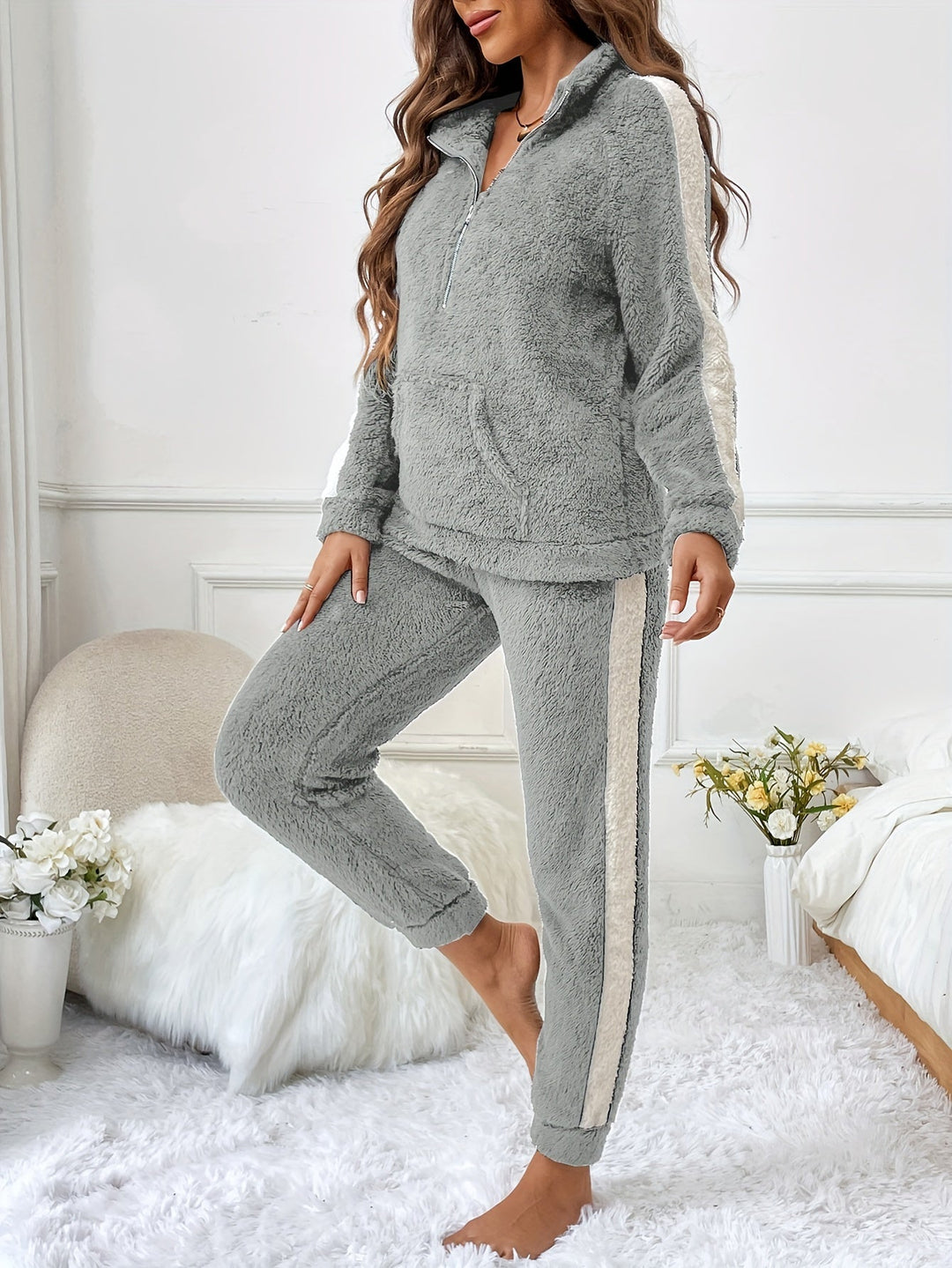 Two-piece women's plush lounge set with half-zip top & joggers, soft winter sleepwear.
