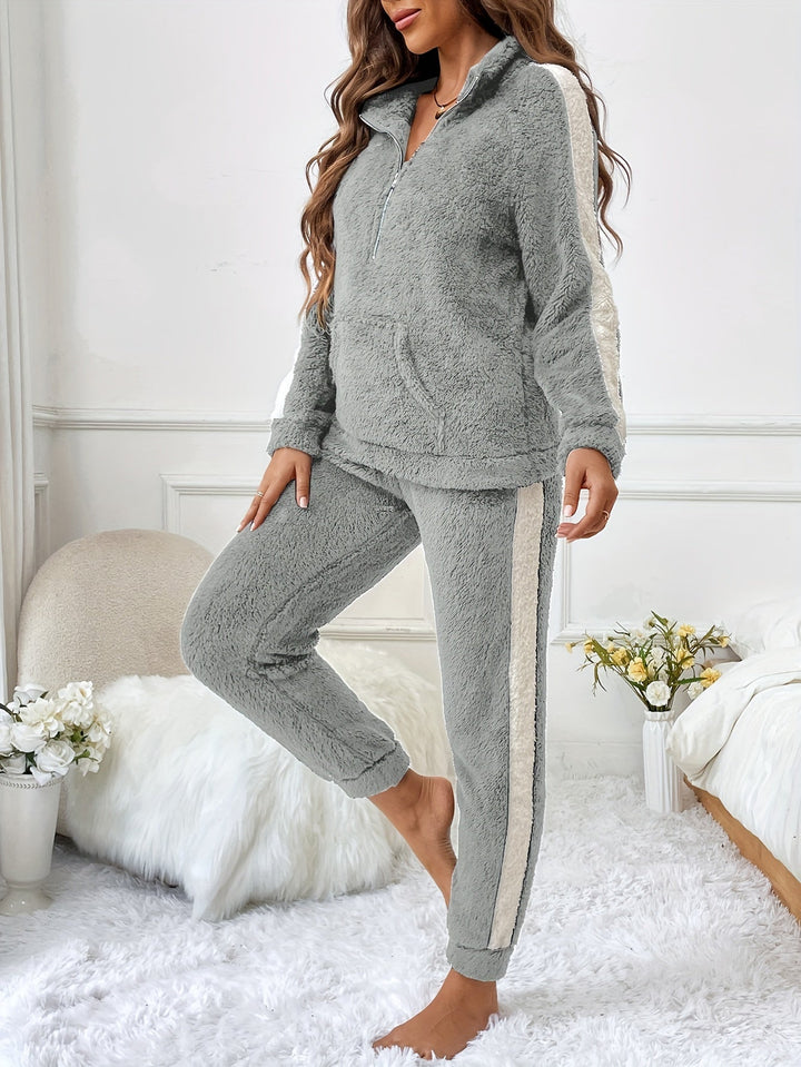 Two-piece women's plush lounge set with half-zip top & joggers, soft winter sleepwear.