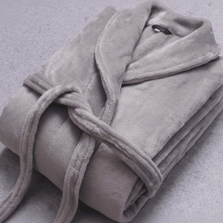 Soft women's plush winter bathrobe, warm and comfy with belt and functional pockets.