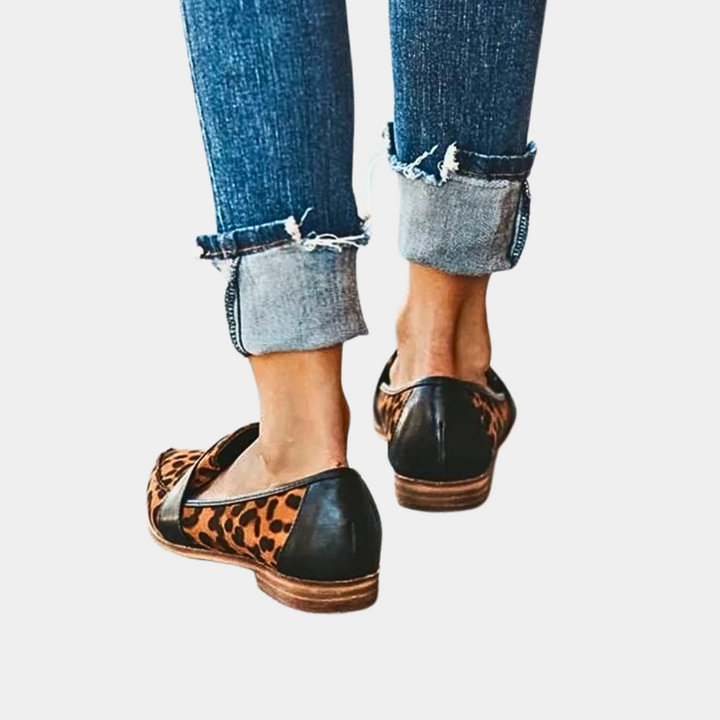 Stylish women's slip-on loafers featuring a sharp pointed toe, perfect for modern elegant looks.