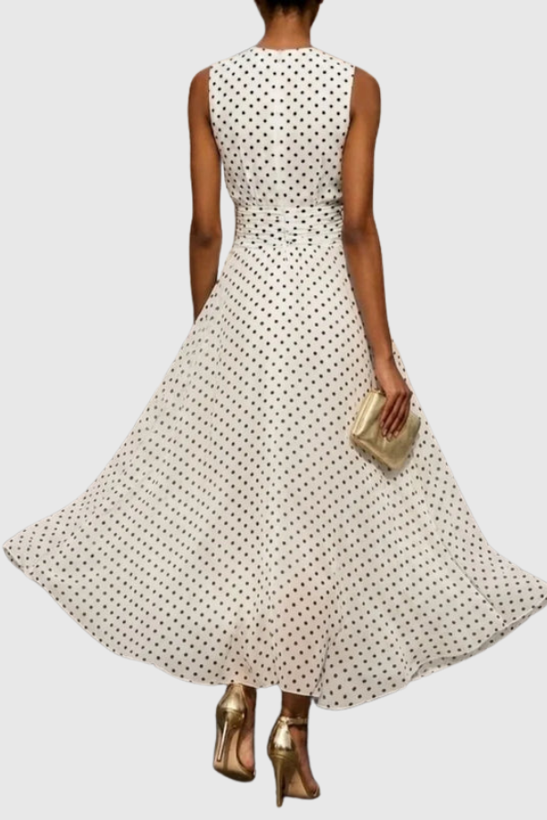 Casual yet elegant polka dot maxi dress for women, featuring a halter neck and keyhole design. Ideal for summer parties.