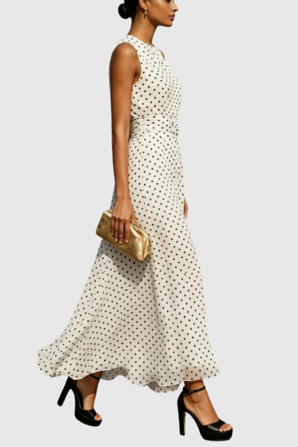 Sleeveless women's polka dot maxi dress with a stylish halter neck, keyhole cutout, and flowy ruffle hem for summer.