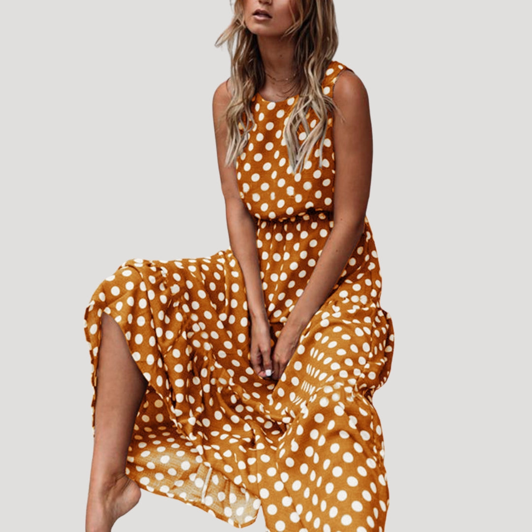 Round neck polka dot midi dress for women. Sleeveless A-line cut, a versatile casual summer day dress.